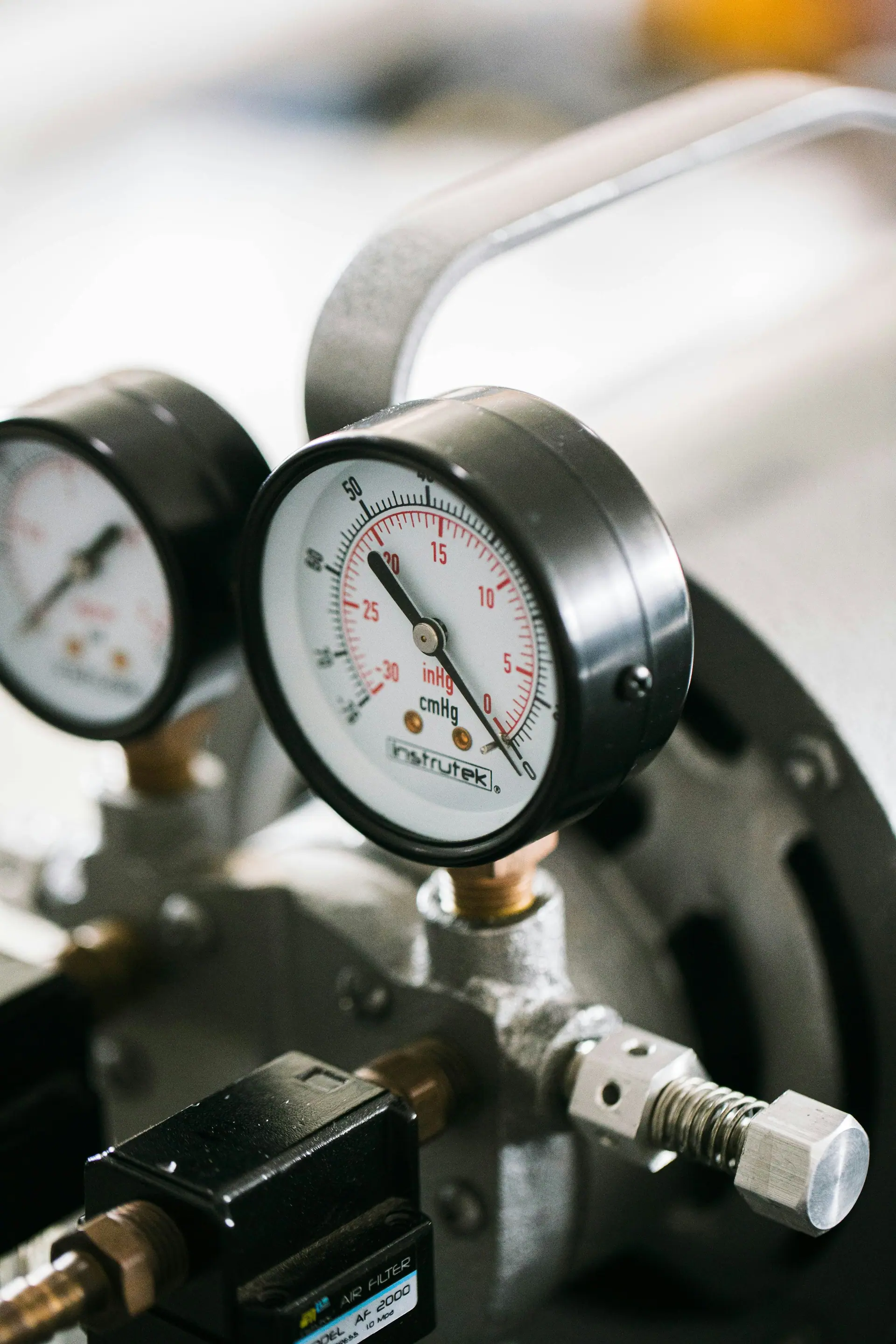 Close-up of refrigeration pressure gauges